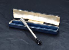 An early Queen Elizabeth Alfred Dunhill silver cheroot holder, with engine-turned decoration and