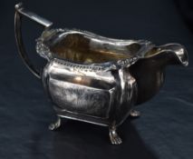 A George III Irish silver milk jug, of moulded rectangular form, the rim having egg-and-dart