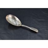A Victorian silver fiddle pattern caddy spoon, the oval bowl with foliate bright-cut engraving,