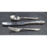 An early Queen Elizabeth II silver christening set, comprising fork, spoon steel bladed and silver