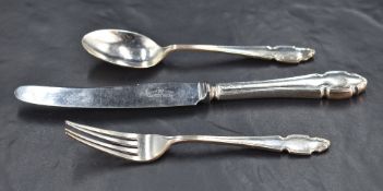 An early Queen Elizabeth II silver christening set, comprising fork, spoon steel bladed and silver