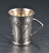 A WMF Britannia metal cup, of flared cylindrical form with Art Nouveau sinuous foliate decoration