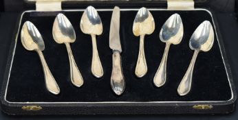 A cased set of six Queen Elizabeth II silver Sandringham pattern grapefruit spoons and curved