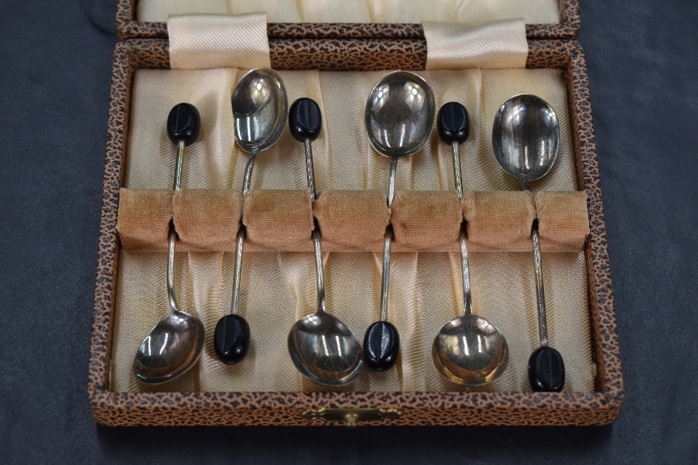 A cased set of six Queen Elizabeth II silver coffee bean spoons, of traditional form with marks