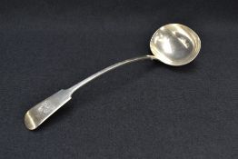 A late Victorian silver fiddle pattern ladle, engraved with Demi lion crest, marks for Sheffield
