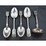 A group of four late Victorian fiddle pattern dessert spoons, engraved with Demi lion crest and with