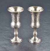 A George V silver Kiddush cup, of traditional elongated bell form with wrigglework engraving and