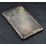 A George VI silver cigarette case, of piano hinged rectangular form with engine-turned decoration