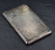 A George VI silver cigarette case, of piano hinged rectangular form with engine-turned decoration