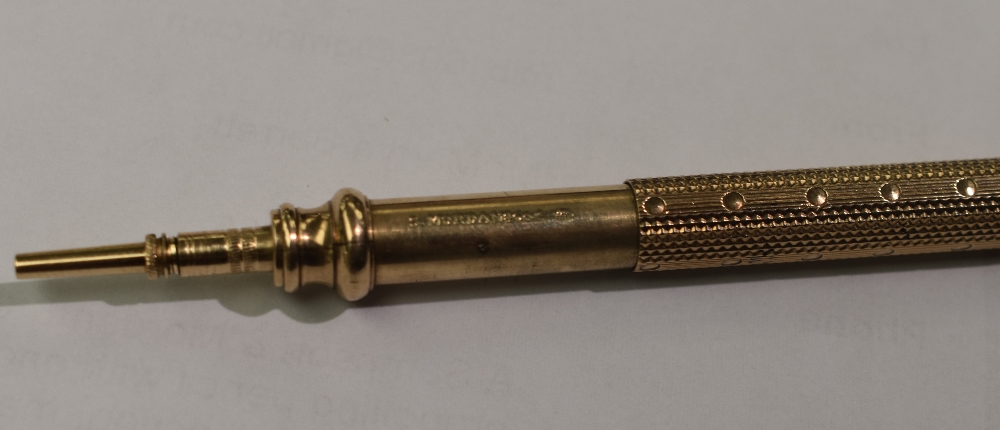 A Sampson & Mordan & Co gilt metal propelling pencil with engine-turned body and push/pull action, - Image 3 of 3