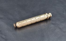 A Sampson & Mordan & Co gilt metal propelling pencil with engine-turned body and push/pull action,