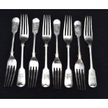 A set of eight Edwardian silver fiddle pattern forks, engraved with demi lion crest and with pip