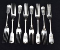 A set of eight Edwardian silver fiddle pattern forks, engraved with demi lion crest and with pip