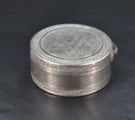 A French 925 grade white metal circular box, engine-turned throughout with 925 standard mark, makers