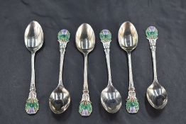 A cased set of six early Queen Elizabeth II silver and enamel Scottish design coffee spoons, each