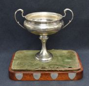 A George V silver agricultural trophy, of flattened and dished circular form with two scrolled