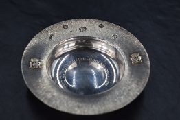 A Queen Elizabeth II commemorative silver jubilee dish, of circular form with textured rim