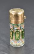 A George V silver gilt and Bohemian glass scent bottle, of cylindrical form, the hinged cover