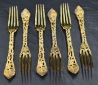 A set of six Queen Elizabeth II silver gilt side forks, having four tapering tines, cast and pierced