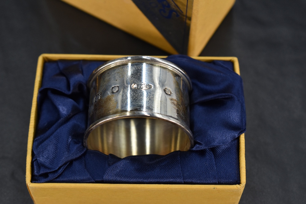 A Queen Elizabeth II 'Millennium' silver napkin ring, of collared cylindrical form with marks for - Image 2 of 2