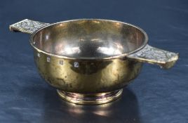A Queen Elizabeth II Scottish silver gilt quaich, of traditional design with Celtic designs to the