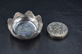 A French white metal Jean Puiforcat dish, of circular form with arcaded rim, the interior with