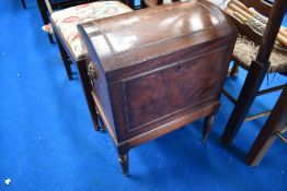A 19th Century mahogany dome top cellarette having lion mask handles and turned legs, with