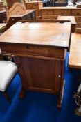 A late 19th or early 20th Century oak school desk of tall proportions