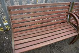 A cast iron framed railway or park style bench with arm to one side only (one of three) approx