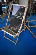 A traditional deckchair , having promotional canvas print for Tirol