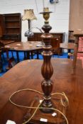 An oak and mahogany table lamp