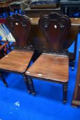 A pair of 19th Century mahogany hall chairs