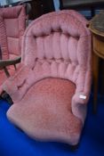 A Victorian spoonback chair having later upholstery