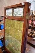 A mahogany room divider with hunting prints and glazed panels, two sections