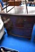 A reproduction Regency style mahogany bow fronted bedroom chest of four long drawers