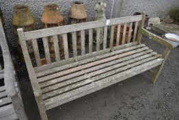A traditional teak garden bench, approx 152cm