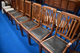 A set of six early 20th Century oak railback dining chairs with drop in seats