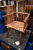 An Antique Welsh style stick back kitchen chair, of primitive form