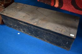 A vintage tin trunk and contents