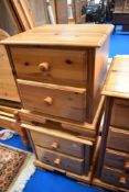 A pair of modern pine single beds and two drawer bedside chests