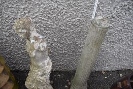 A concrete garden ornament and pillar