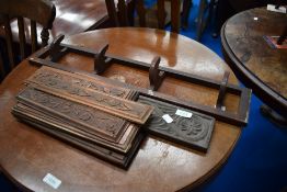 A selection of 19th Century carved panels of small proportions and a coat rack