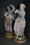 Two 19th century German bisque porcelain figurines, regal gent and lady in period dress, both in