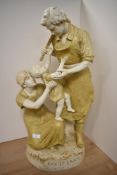 A Royal Dux figural group, depicting mother and father with child, 'Pax Et Labour' to base,