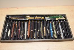A collection of vintage retractable pencils.