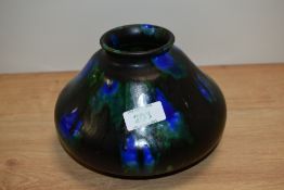 A Minton Hollins & Co Astra Ware pottery vase, c.1920s, in a mottled dripped glaze, and measuring
