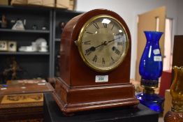 A 20th Century Gustav Becker mantel clock, having a domed mahogany case, a silvered roman dial,