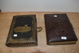 Two Victorian photograph albums, some with photos, both having coloured illustrations, one having