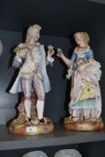 A pair of 19th century German bisque porcelain figurines, depicting courting couple, unmarked to