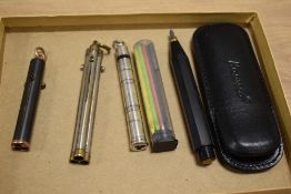 Three multi colour retractable crayon/pencils and a Kaweco pencil with spare coloured leads